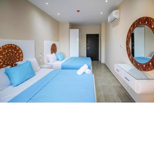 1-bedroom apartment with 2 balconies overlooking the pool and aqua park in View Aqua Apartments and Suits in Mirage Bay Resort & Aquapark Hotelm in Mirage Bay Resort and Aquapark