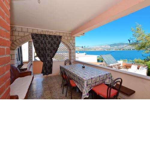 A - large apt with big terrace next to the beach