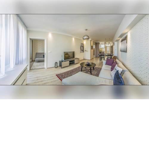 A modern downtown home with balcony at an iconic square