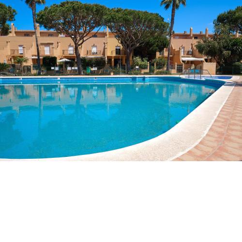 Adosado con jardín y piscina en Chiclana Barrosa-Sancti Petri