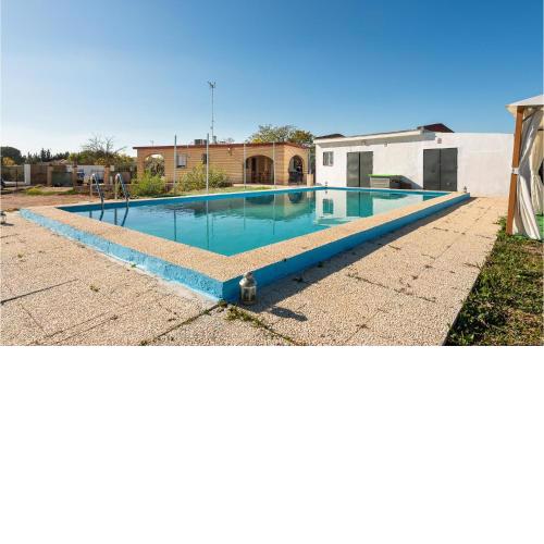 Amazing home in Sanlucar La Mayor with WiFi, 3 Bedrooms and Outdoor swimming pool