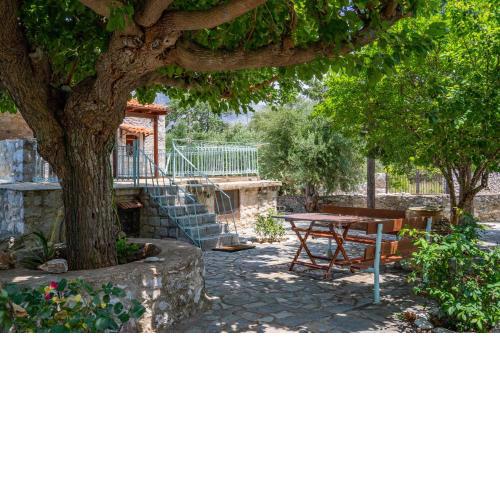 An entire traditional stone house with huge yard.