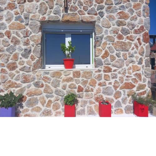 Anemomylos House