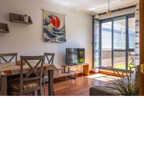 Apartamento con patio en frente de la playa