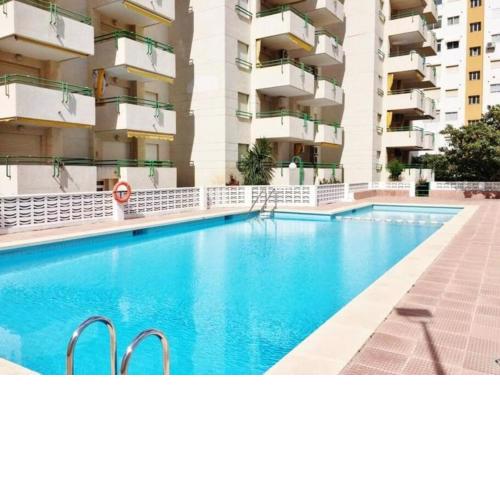 apartamento con piscina y garaje cerca de la playa