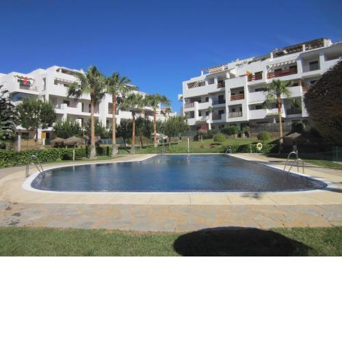 Apartment in La Cala within a secure complex with large pool and lovely gardens