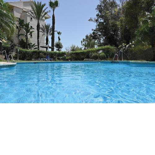 Apartment with large terrace, pool view & gym
