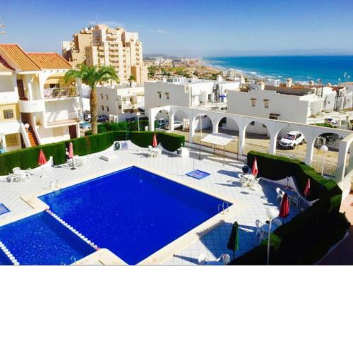 Apartment with pool, sea views & balcony less than 10min walk to La Mata Beach!