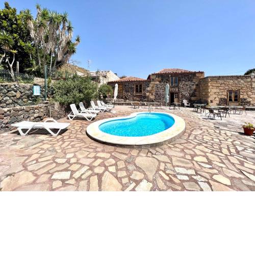 Apto en caserío rural con cocina, piscina, Wifi, barbacoa y jardín compartidos