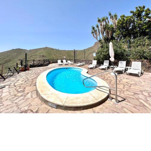 Apto en una casa rural, con cocina, piscina, barbacoa compartidas y vistas en Sur de Tenerife