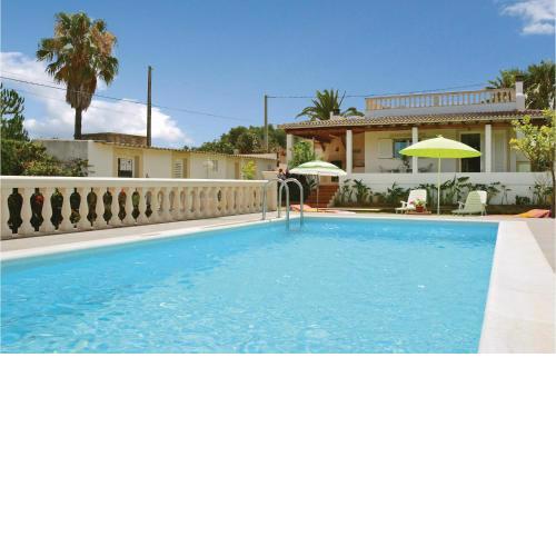 Awesome home in Muro with 2 Bedrooms and Outdoor swimming pool