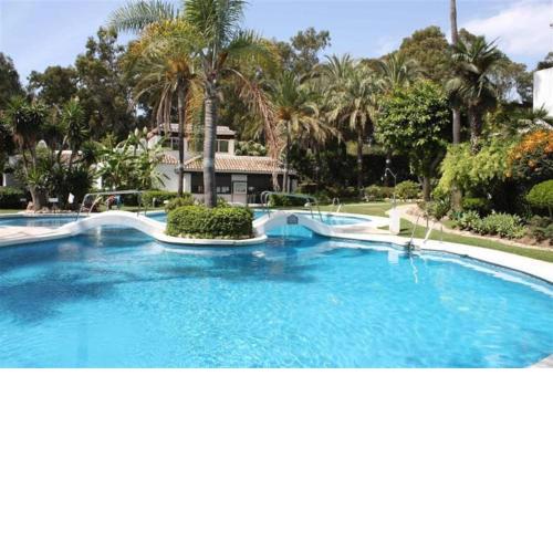 Beachfront development with tropical gardens.