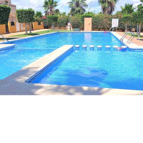 Beautiful 3 Bed Townhouse with landscaped communal pool area