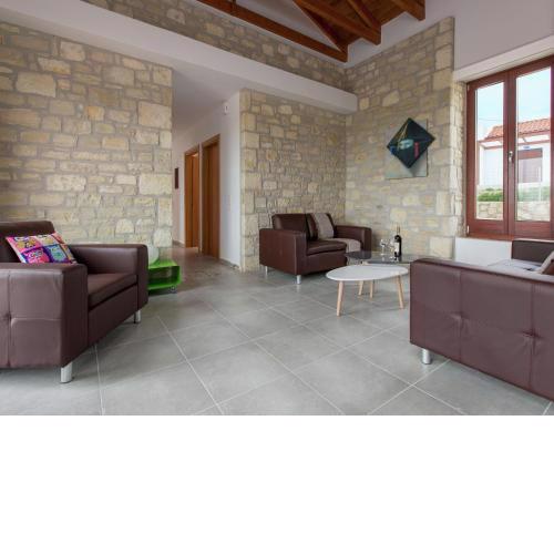 Boutique Villa in Arkadi with Pool and deck chairs
