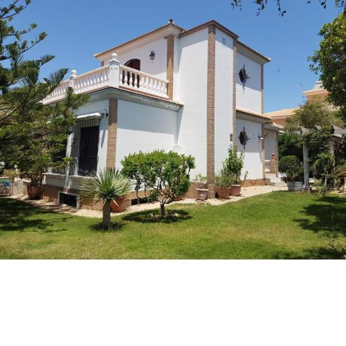 Casa con jardín en la playa