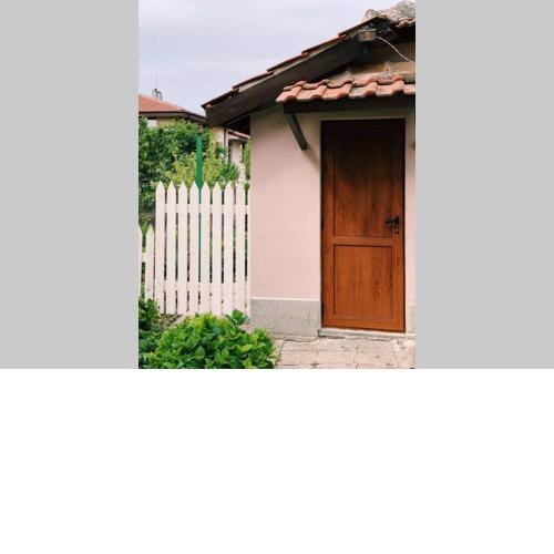 Cute Little House with a White Picket Fence