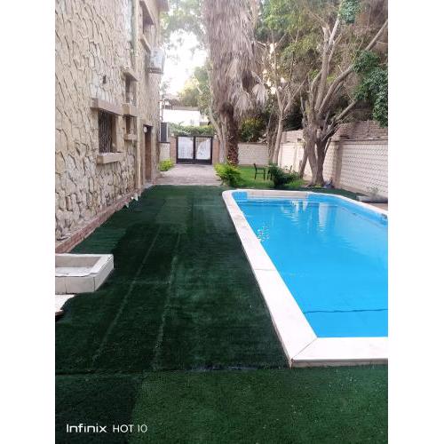 Distinctive villa with private entrance, large swimming pool and garden