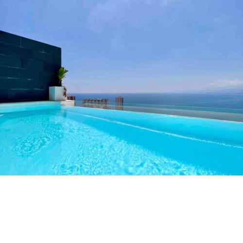 Faro Cullera. Villa pareada. Infinity pool .