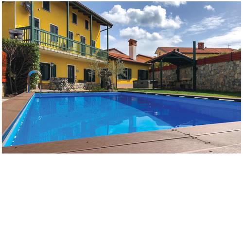 Four-Bedroom Holiday Home in Komen