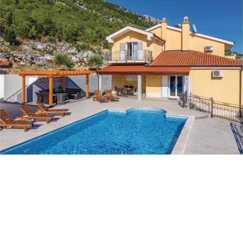 Four-Bedroom Holiday Home in Vrgorac