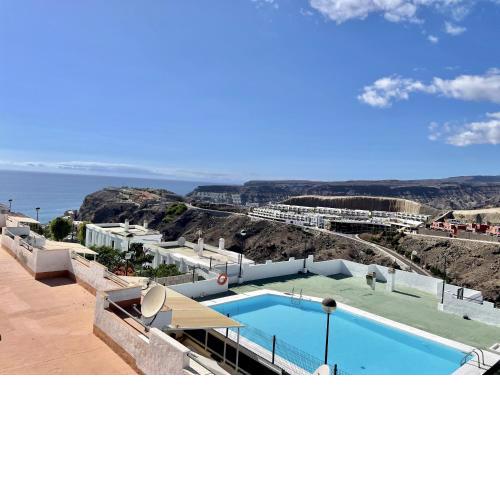 HomeForGuest Amplio apartamento con piscina y terraza en Mogan