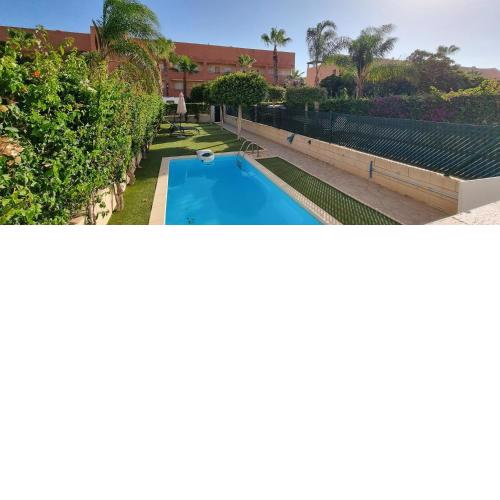 Homes of Spain, Apartamentos Paraíso Vera Playa, Ed Nuku Hiva, Bajo X con PISCINA PRIVADA y jardín privado a PIE de PLAYA , WIFI