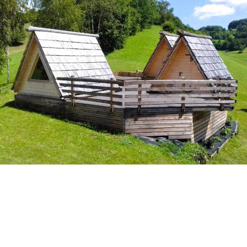 House Of Nature With Wooden Tents