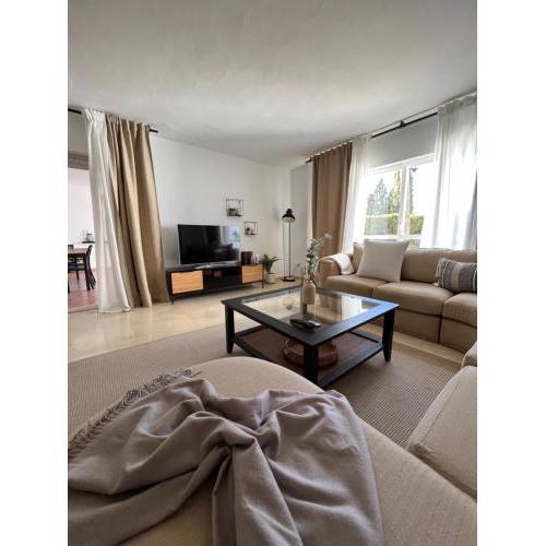 Impeccable large apartment with immense terrace and private garden overlooking the mountain, featuring 2 bedrooms and sleeping up to 4 guests located 100 meters from Plaza Maestranza