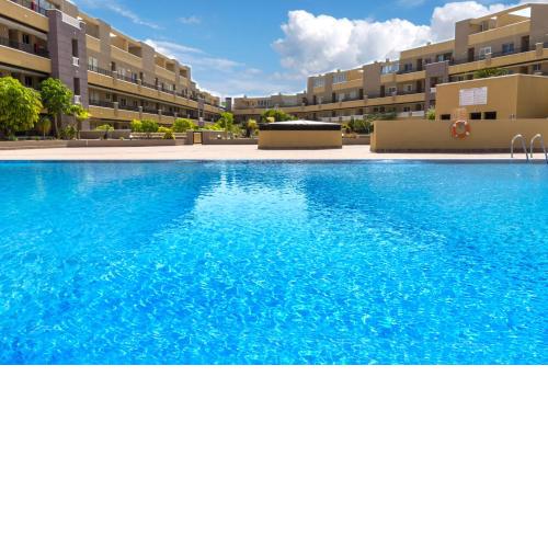 La Perla Beach Apt with Pool