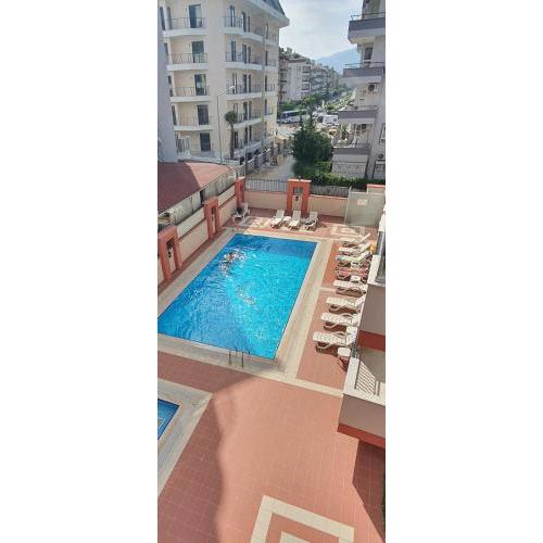 Large sunny apartment with swimming pool, 300 meters from the sea