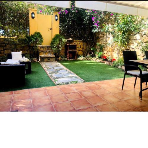 Lujoso bajo con jardín y jacuzzi privado Calahonda Royale