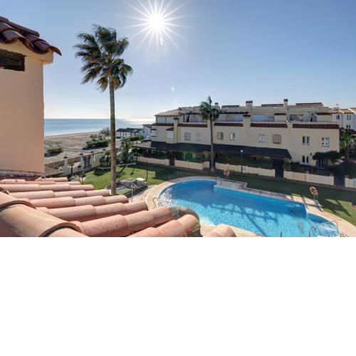 Luxury modern beachfront 3 bed gated community townhouse with pool, sun terrace, sea views close to all amenities