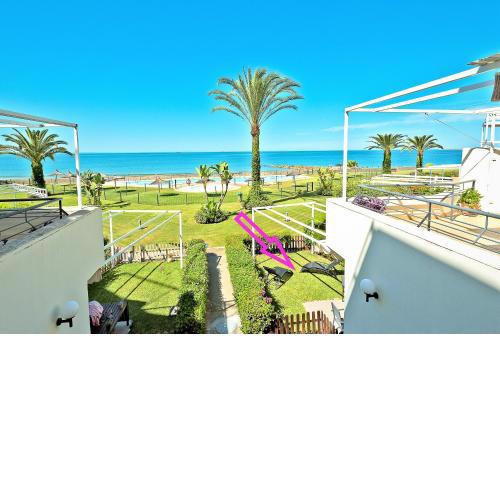 On Beach Deluxe Apartment with Pools and own Garden