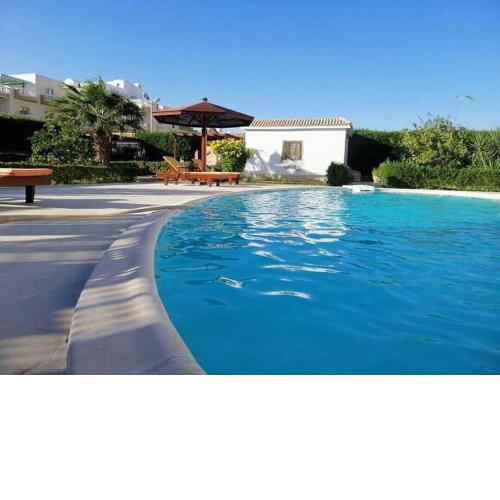 One room in a compound with the swimming pool
