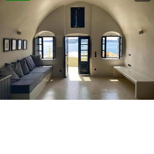 Phaedra and Ariadni - Caldera Sea and Volcano Sea View 2 joined Houses in the Old Port of Fira, Santorini 4br-2ba-2livingr
