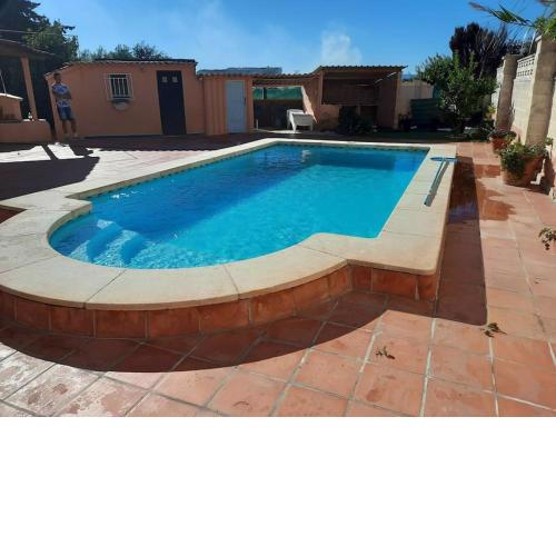 Private villa with heated pool close to the beach.