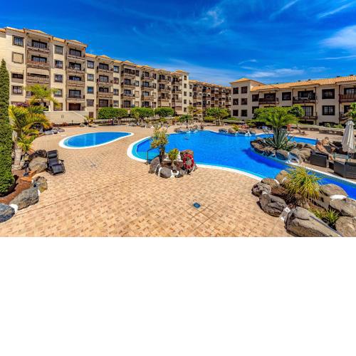 Relax in the sun at apartment with ocean view and pool