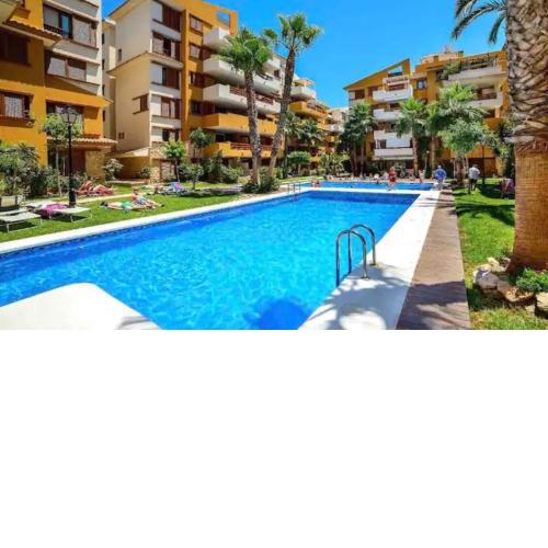 Turquesa Apartment,Punta Prima ,2 bed, 4 swimming pools and cabriolet Peugeot 307 included