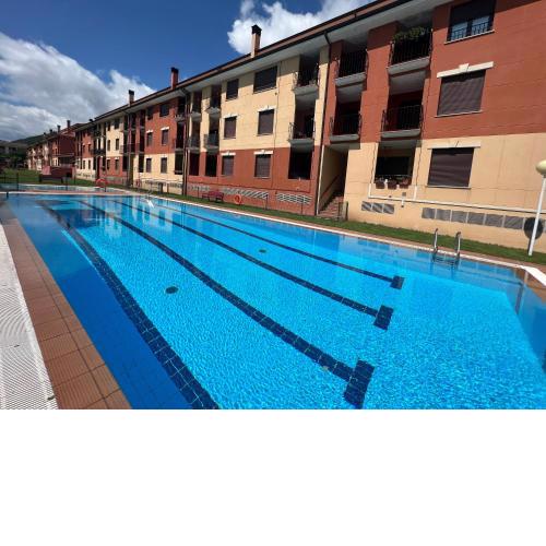 VILLA CARMEN. coqueto apartamento con piscina y garaje