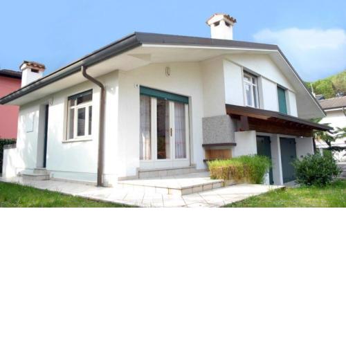 Villa with garden and patio with fireplace