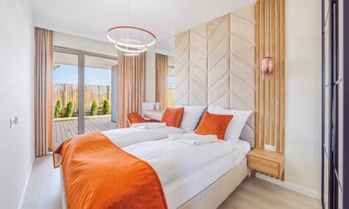 Baltské more len 350 m od pláže: Štýlové apartmány Sun & Snow GEA ECO pre 4 osoby s terasou a fitness centrom