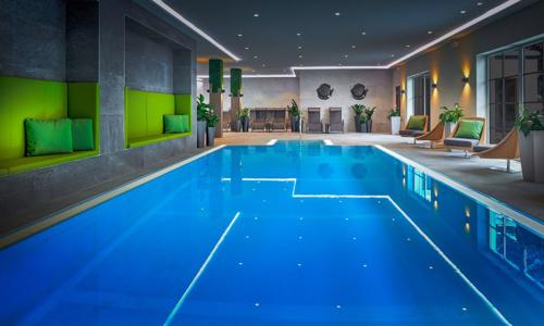 Vysoké Taury 300 m od zjazdovky: Hotel ever.grün KAPRUN **** s polpenziou, wellness a fitness + skibus a zľava